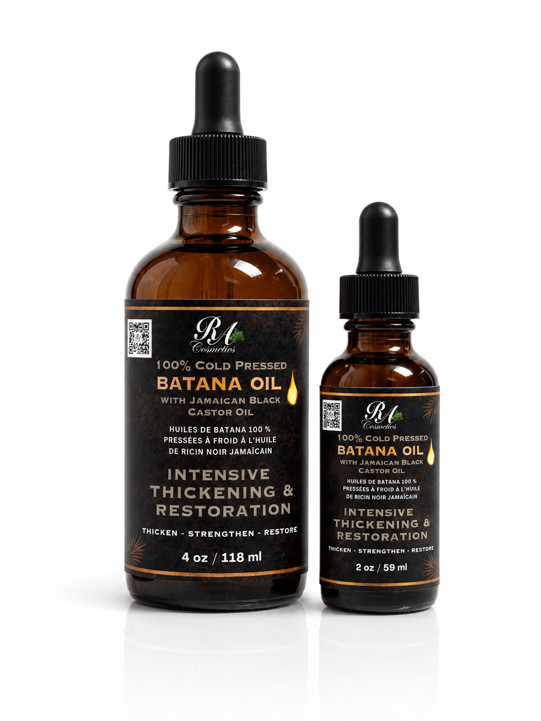 Two bottles of Batana Oil with droppers on a white background