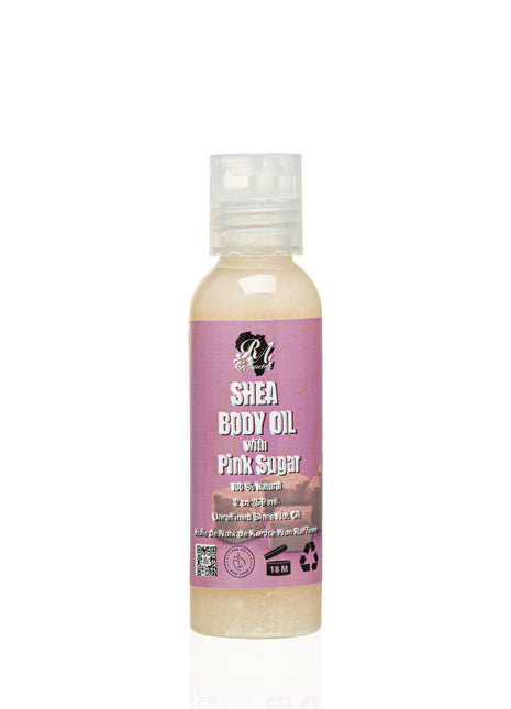 Shea body oil bottle with pink label on a white background